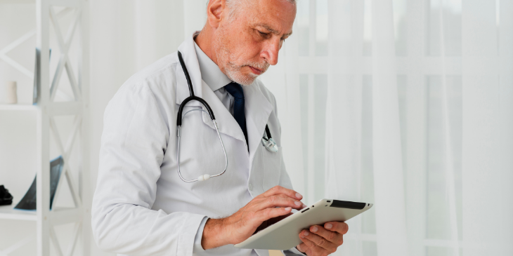 A doctor using digital dashboards.