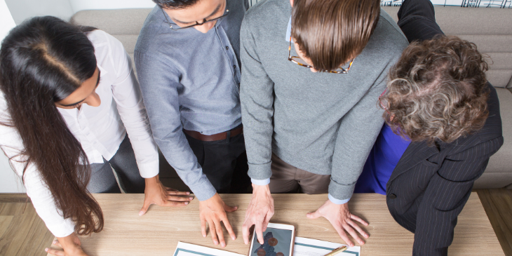 Four coworkers playing a game.