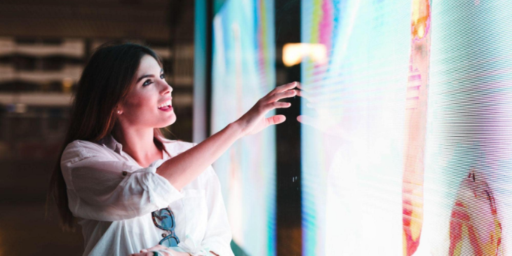 Girl interacting with a digital sign.