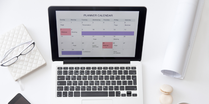 A laptop showing a planner calendar.