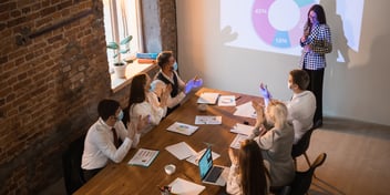 A woman doing her presentation using wireless screen sharing tool.