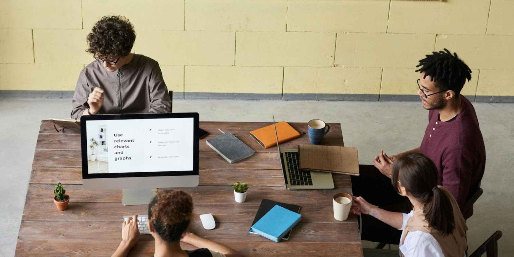 Employees working in a meeting room.