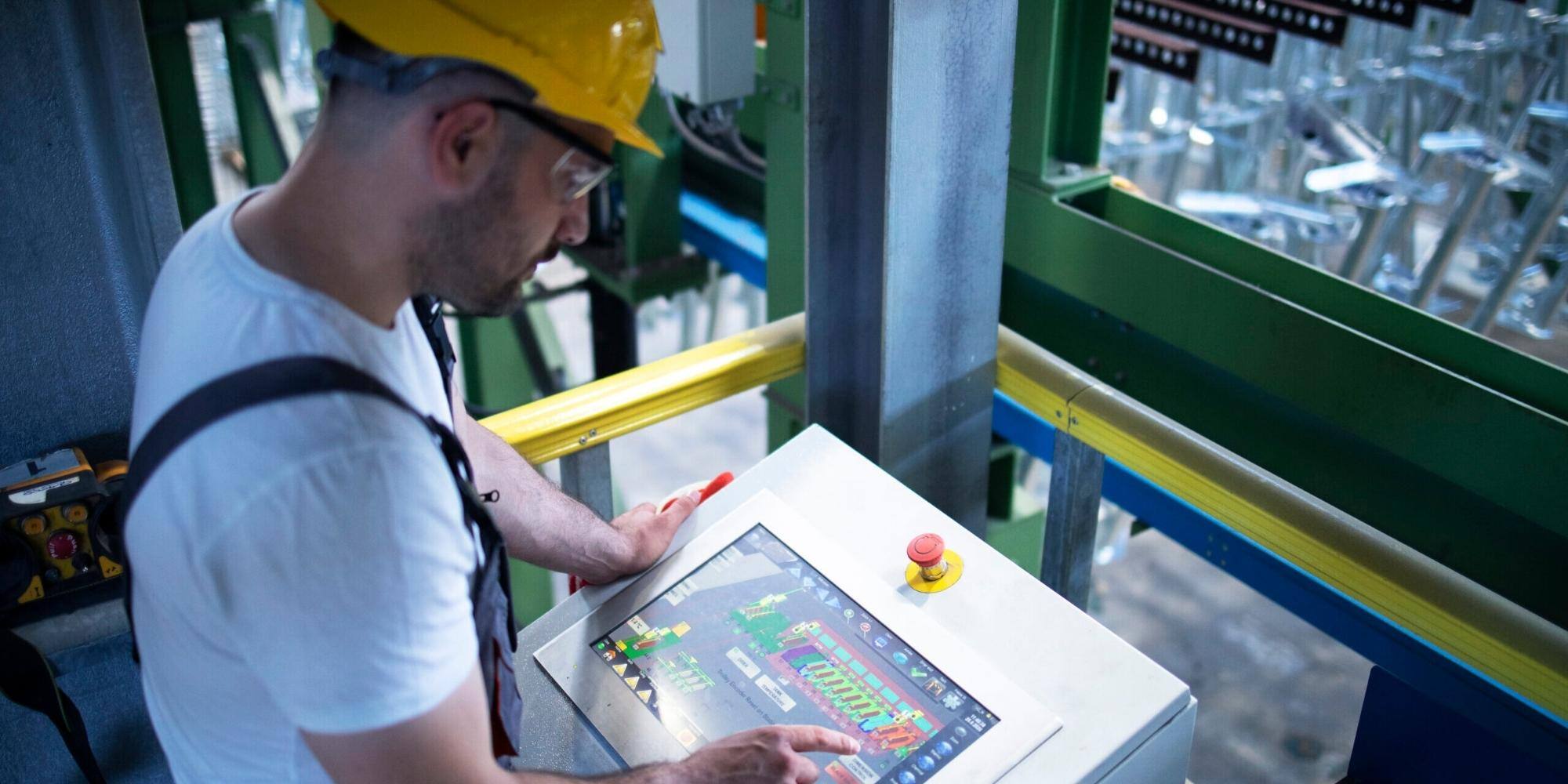 A man is working and checking digital signage.