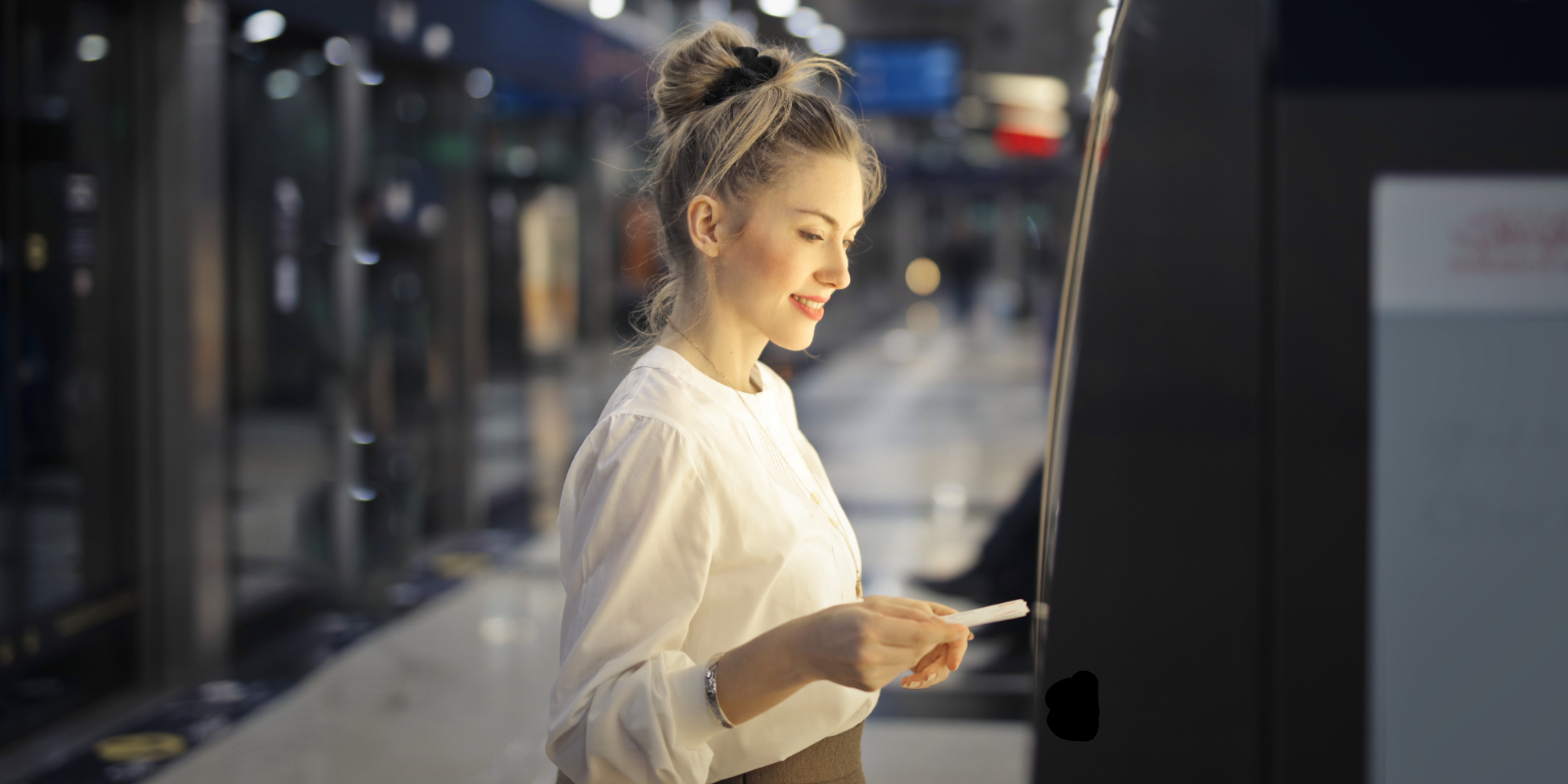 Woman using digital signage.